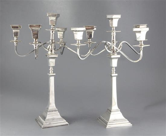 A pair of 1950s silver four branch, five light candelabra, by Alexander Smith, 96 oz.